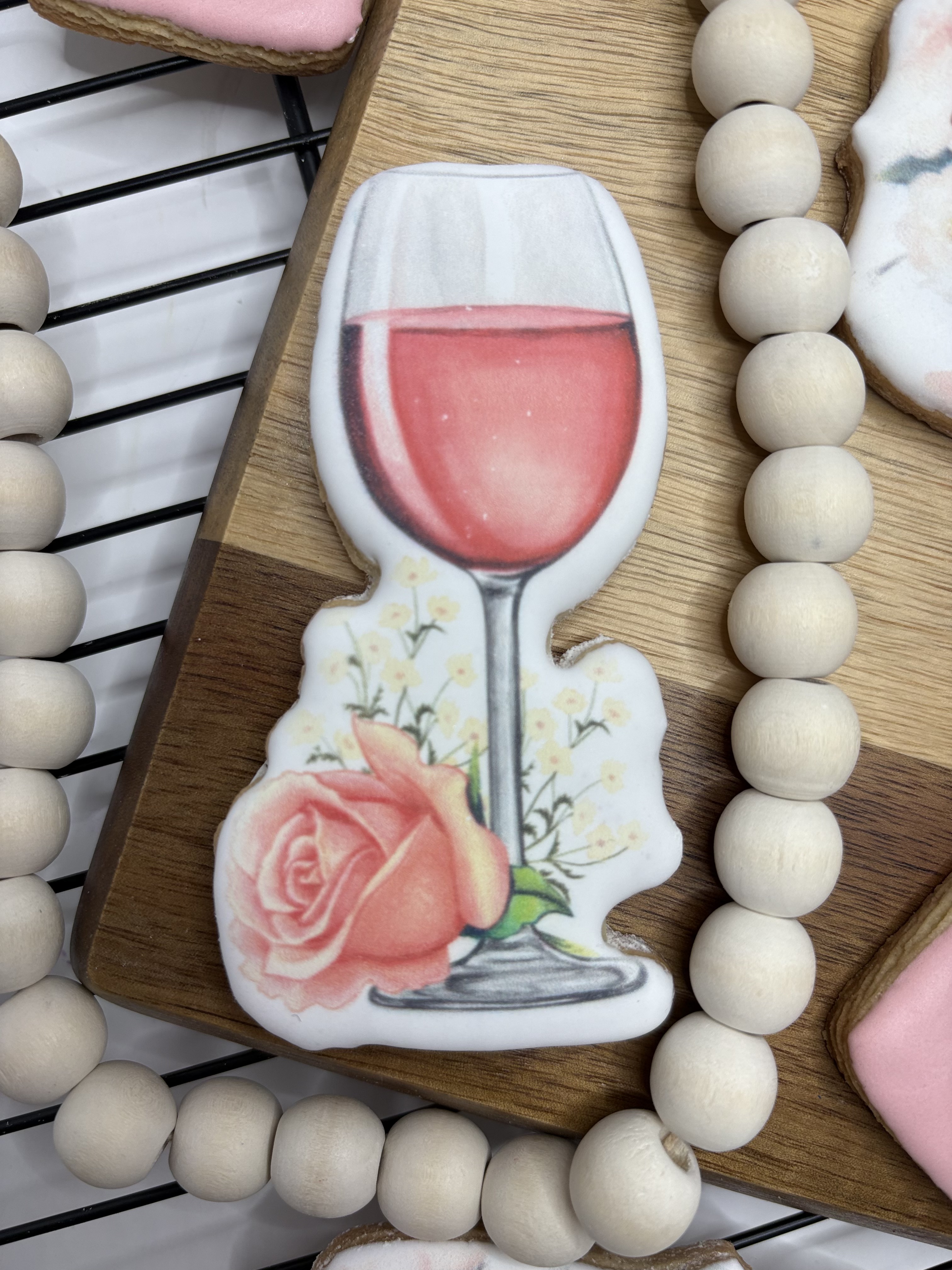 Wine glass shaped printed cookie with floral detail